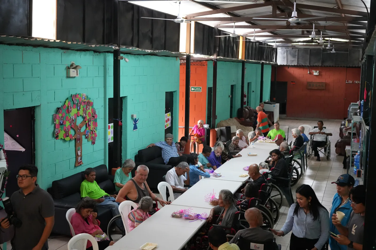 An afternoon in the common room with residents, staff, and volunteers.