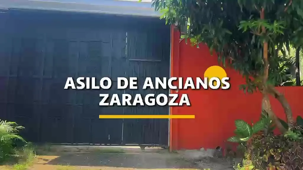The painted red entrance to Hogar de Ancianos Giuseppe Angelucci.